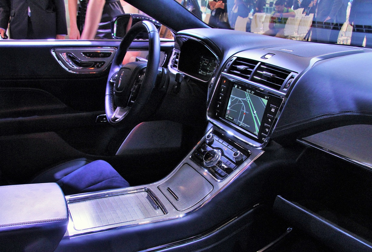 An uncluttered console with healthy doses of aluminum greet Continental drivers.